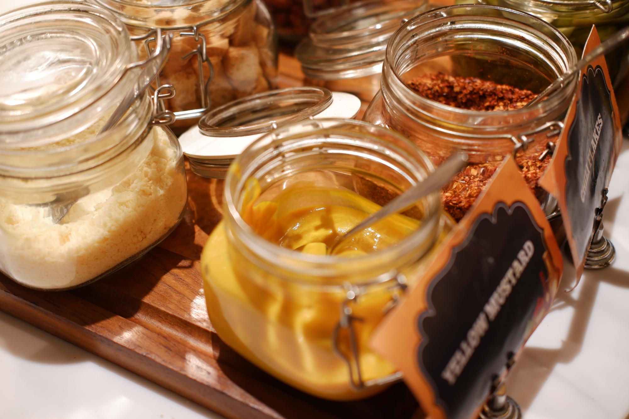 Close-up of mise en place jars and labels